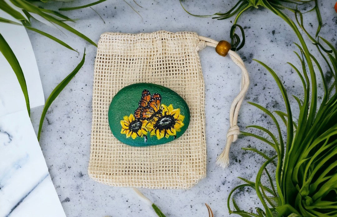 Emerald Blossoms –  Hand-painted sunflowers and a butterfly on a emerald rock
