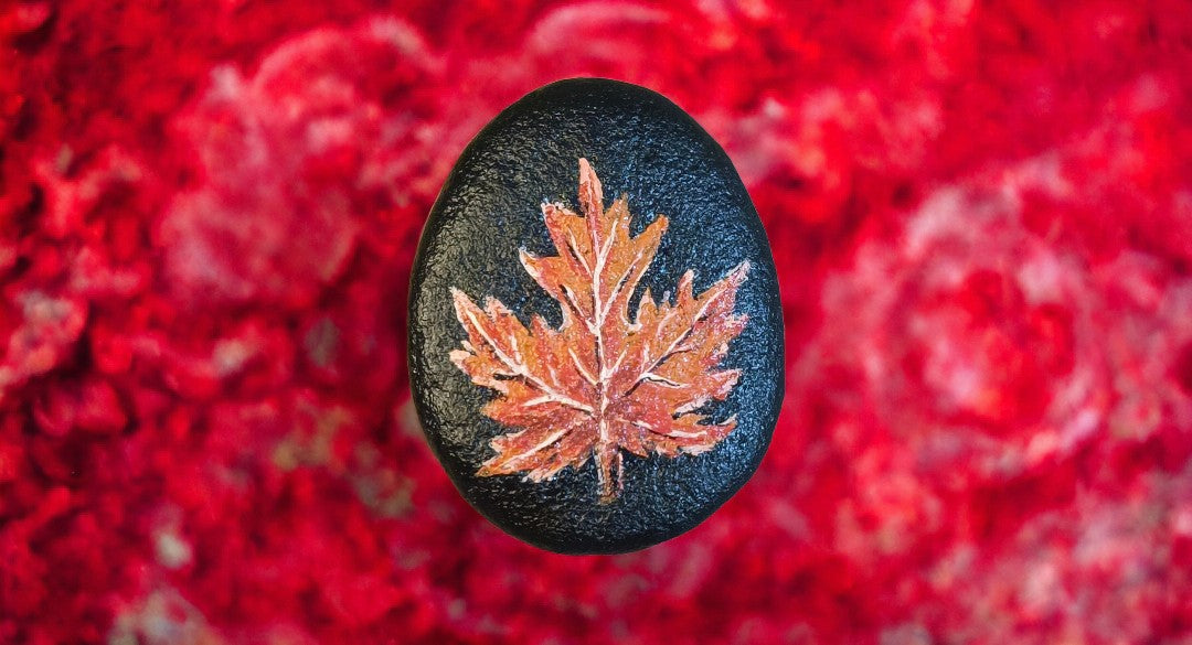 Emerald Blossoms - Hand-painted the maple leaf symbol of Canada with a striking black background on rocks